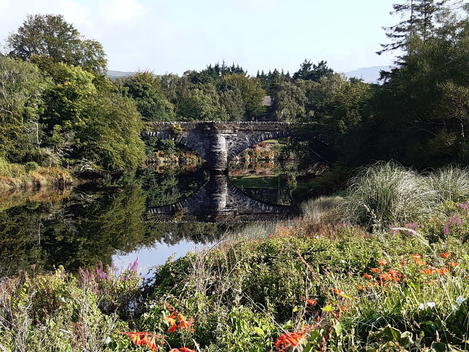 Stone bridge reflected in the river near Kenmare